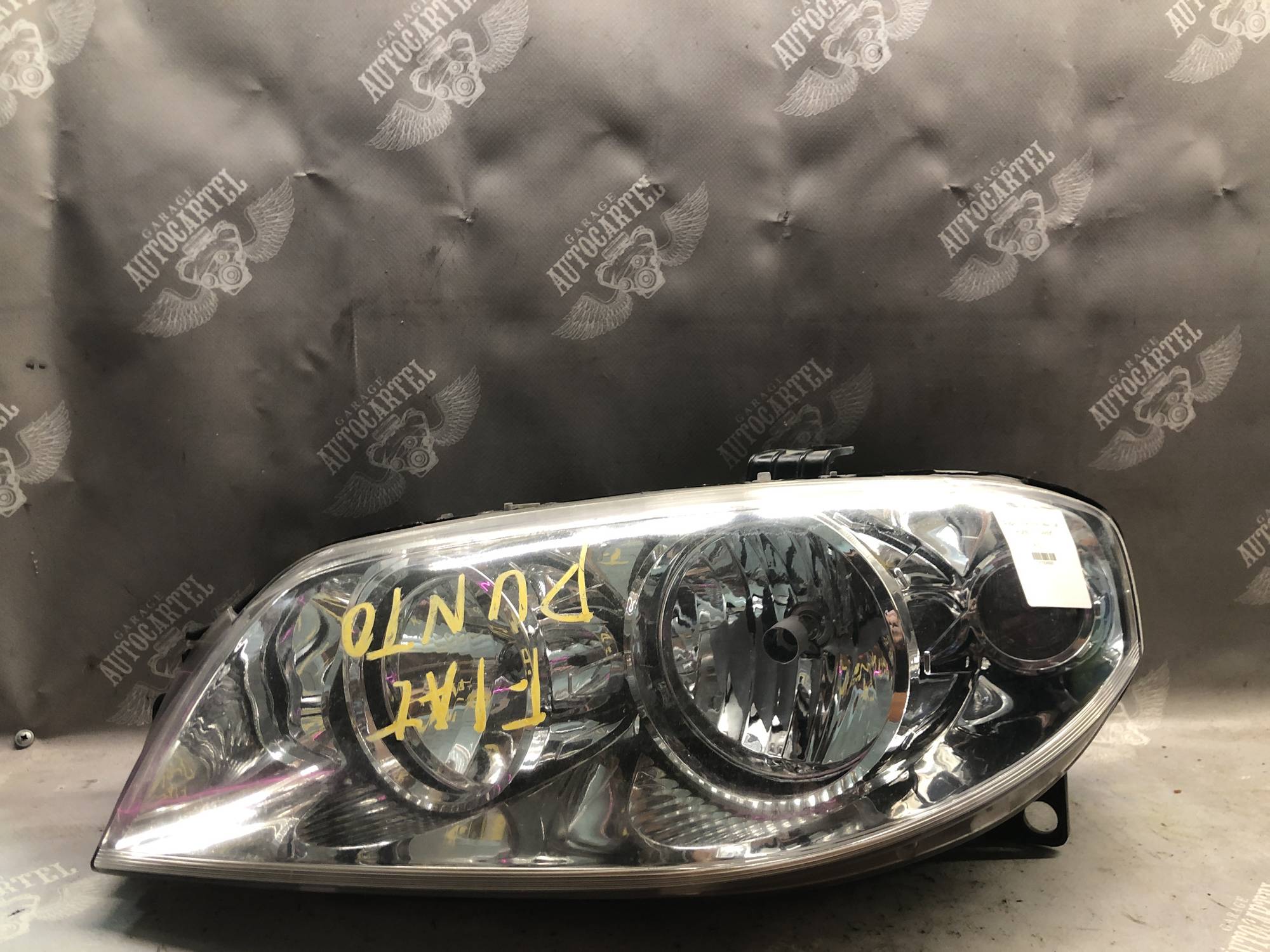 Фара передня ліва Fiat Punto 21104695