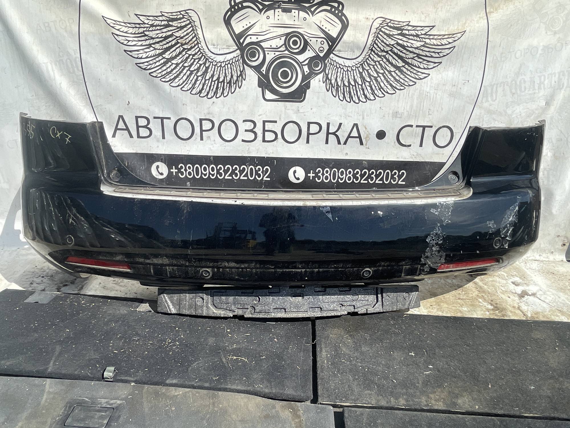 Бампер задній Mazda CX 7 21120015
